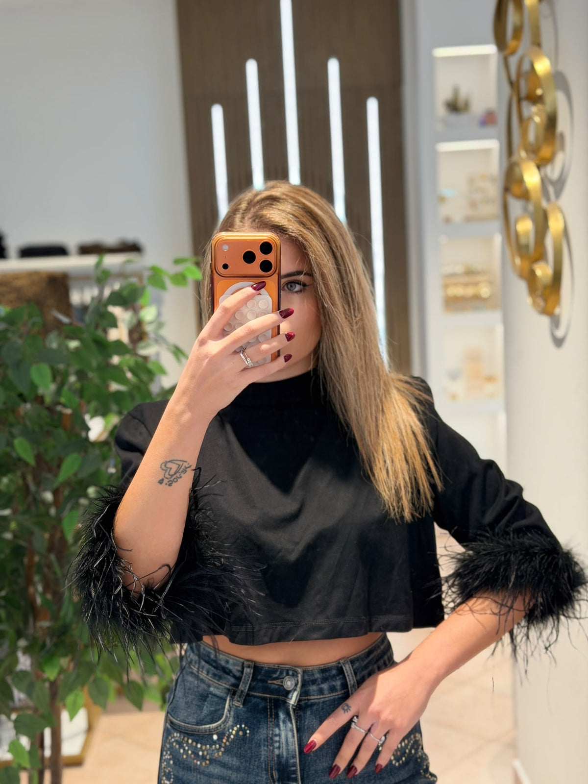 Maglia con piume